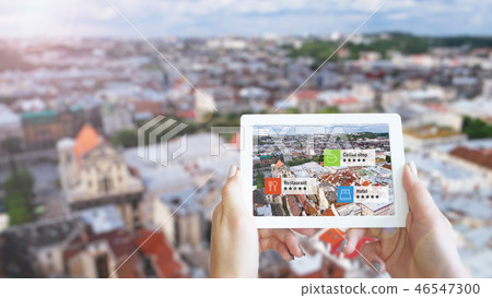 Augmented reality marketing concept. Hand holding tablet use AR application Augmented reality marketing concept. Hand holding tablet use AR application 46547300