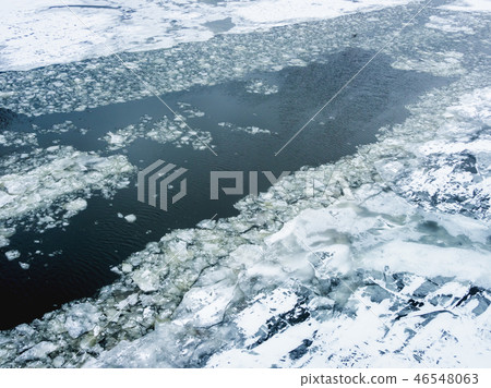 Broken ice on a frozen river. shards of ice. Broken ice on a frozen river. shards of ice. 46548063
