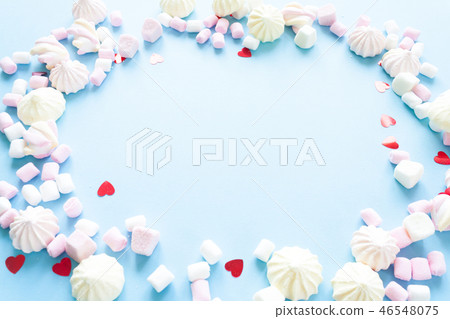 various pastel marshmallows on a blue background various pastel marshmallows on a blue background 46548075