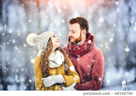 Happy Young Couple in Winter Park laughing and having fun. Family Outdoors. Happy Young Couple in Winter Park laughing and having fun. Family Outdoors. 46548780