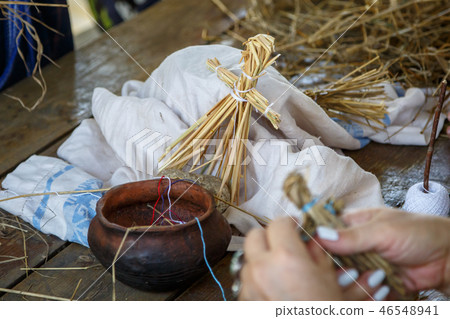 A toy made of straw in the shape of a little human 46548941