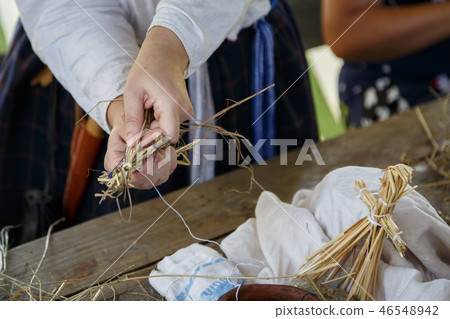 Woman shows how to make a straw human Woman shows how to make a straw human 46548942