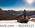 man from behind on the top of a snowy mountain 46549125
