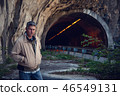 a man out in a tunnel 46549131
