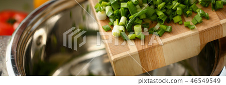 Cook holds knife in hand and cuts on Cook holds knife in hand and cuts on 46549549