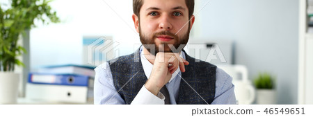 Handsome smiling bearded clerk man at office workplace Handsome smiling bearded clerk man at office workplace 46549651