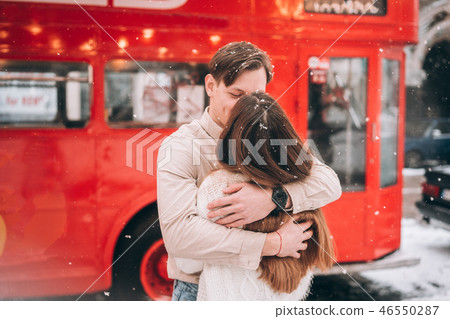 beautiful young couple posing by the old bus beautiful young couple posing by the old bus 46550287