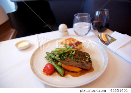SINGAPORE, - JULY 22, 2016: grilled lamb fillet in Rosmarinjus with carrots, asparagus, cherry 46551401
