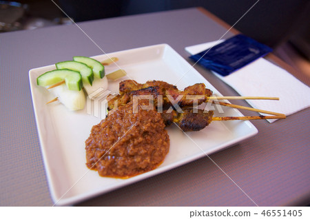 SINGAPORE, - JULY 22, 2016: Chicken and lamb satay skewers with onions, salad cucumber spicy peanut 46551405