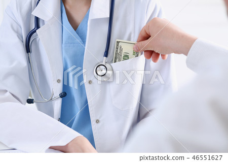 Female doctor hold in hands bunch 46551627