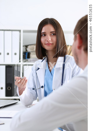 Beautiful smiling female doctor hold Beautiful smiling female doctor hold 46551635