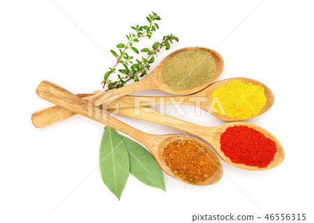 mix of spices in wooden spoon isolated on a white background. Top view. Flat lay. Set or collection 46556315