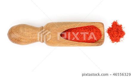 sweet paprika spice in a wooden spoon isolated on white background. Top view. Flat lay sweet paprika spice in a wooden spoon isolated on white background. Top view. Flat lay 46556329