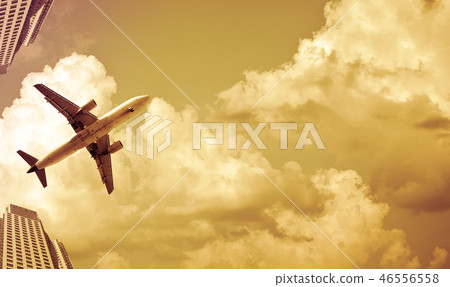 airliner in sky on skyscrapers background airliner in sky on skyscrapers background 46556558
