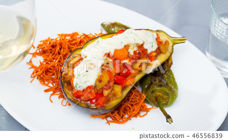 Eggplant baked with vegetables and tzatziki 46556839