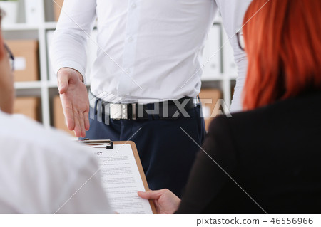 Male arm in shirt offer contract form on clipboard Male arm in shirt offer contract form on clipboard 46556966