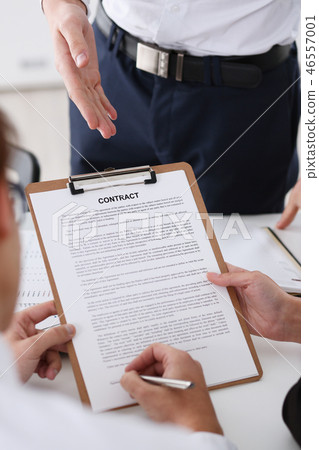 Male arm in shirt offer contract form on clipboard Male arm in shirt offer contract form on clipboard 46557001