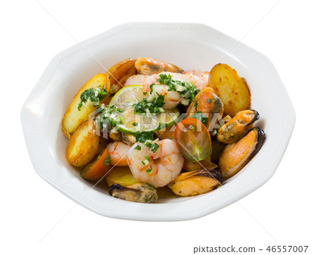 Stewed slices of potato with seafood Stewed slices of potato with seafood 46557007