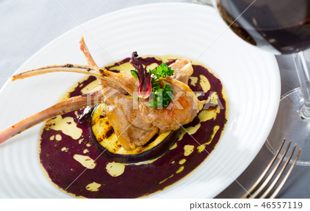 Lamb ribs with aubergine and wine sauce Lamb ribs with aubergine and wine sauce 46557119