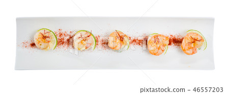 Top view of grilled shrimps on rice with lime and saffron Top view of grilled shrimps on rice with lime and saffron 46557203