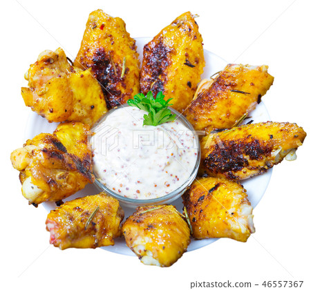 Chicken wings served with mustard sauce Chicken wings served with mustard sauce 46557367