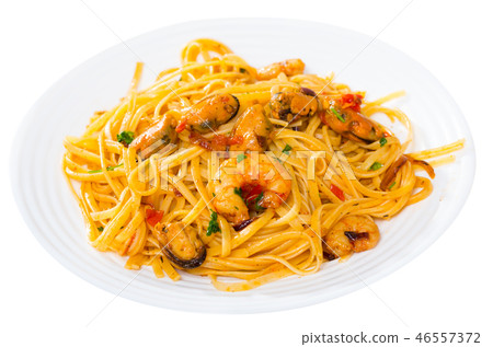 Image of delicious pasta of shrimps, mussels and greens 46557372