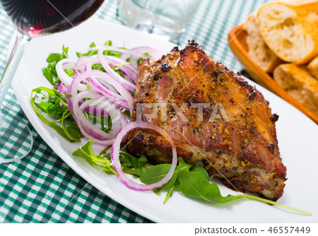 Roasted pork rack of ribs with greens Roasted pork rack of ribs with greens 46557449