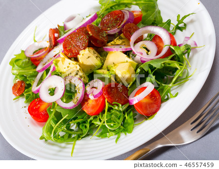 Salad of arugula with avocado, roasted chorizo sausage Salad of arugula with avocado, roasted chorizo sausage 46557459