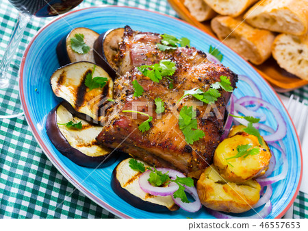 Roasted pork carre with vegetables Roasted pork carre with vegetables 46557653