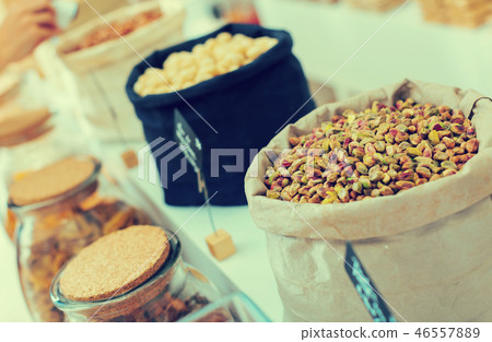Image of green pistachios in container 46557889