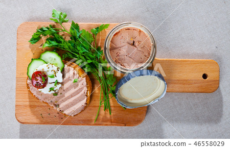 Top view of toast with pate, fresh cheese on wooden board Top view of toast with pate, fresh cheese on wooden board 46558029