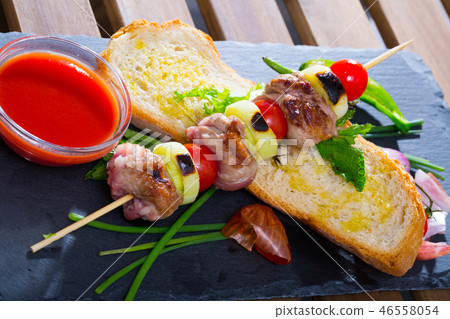 Shish kebab from mutton with tomato sauce 46558054