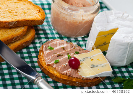 Pate on toasted bread with soft blue cheese Pate on toasted bread with soft blue cheese 46558162