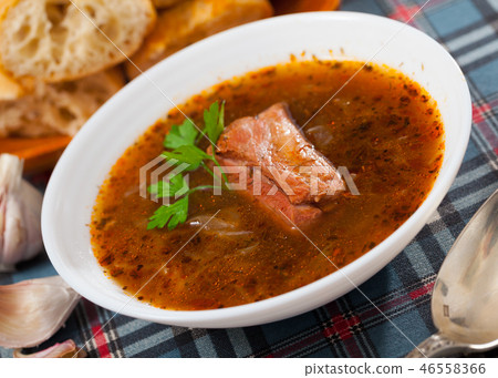 Shchi with pork in mushroom broth 46558366