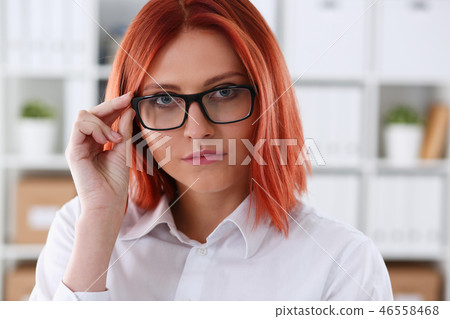 Red haired business woman with glasses Red haired business woman with glasses 46558468