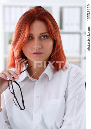 Red haired business woman with glasses Red haired business woman with glasses 46558469