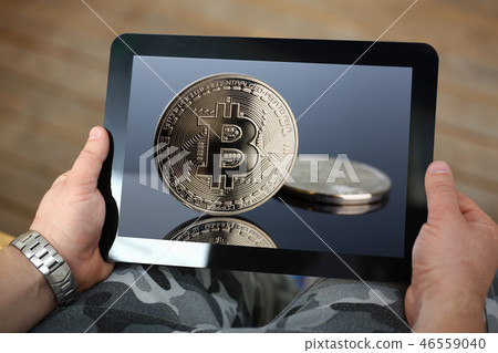Hipster arms hold tablet pc with btc sign coins Hipster arms hold tablet pc with btc sign coins 46559040