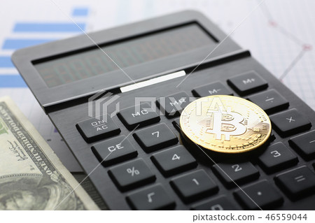 The bitcoin lies on the keyboard of the black The bitcoin lies on the keyboard of the black 46559044