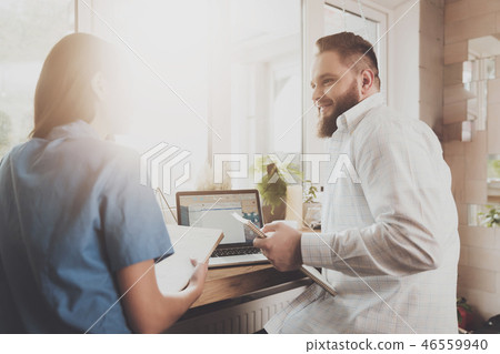 A man discusses work affairs with a girl A man discusses work affairs with a girl 46559940