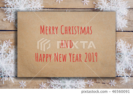 Wooden brown christmas background with snowflakes Wooden brown christmas background with snowflakes 46560091