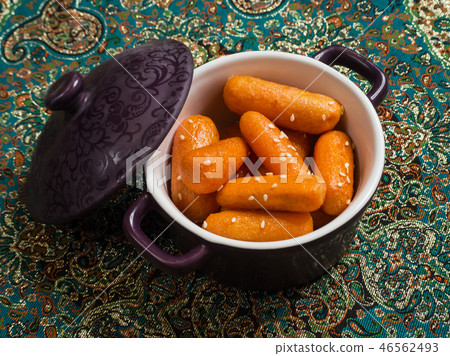 Honey glazed carrots with sesame seeds. Top view. Honey glazed carrots with sesame seeds. Top view. 46562493