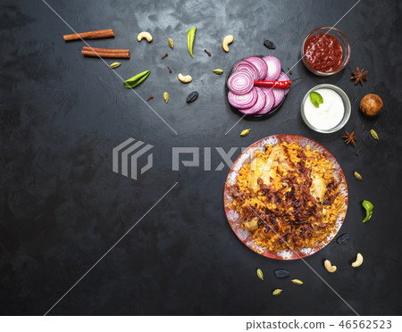 Chicken Kabsa overhead view on black table.  46562523