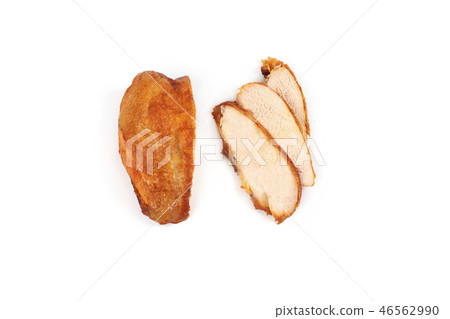 A close up of grilled, sliced chicken breast isolated on white background . A close up of grilled, sliced chicken breast isolated on white background . 46562990