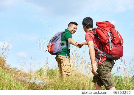 Climbing hikers Climbing hikers 46563295