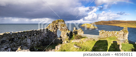 The castle ruins next to Tulm Island at Duntulm Bay on the Isle of Skye - Scotland The castle ruins next to Tulm Island at Duntulm Bay on the Isle of Skye - Scotland 46565011