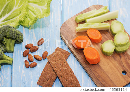A set of fresh vegetables on a wooden table.  46565114
