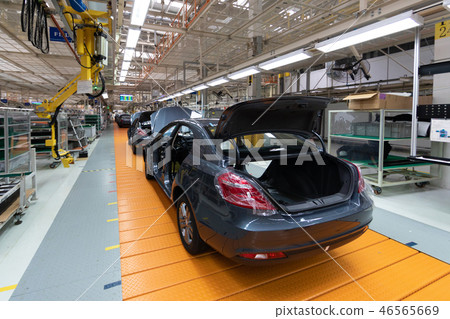 Assembled car is on the Assembly line. Robotic equipment makes the Assembly of the car. Modern car 46565669