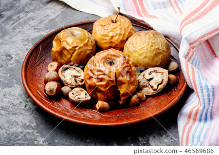 Baked apples with nuts Baked apples with nuts 46569686