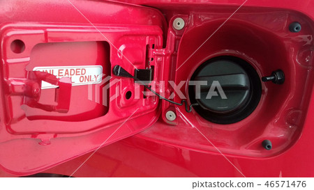 Petrol nozzle used to pumping petrol into the car Petrol nozzle used to pumping petrol into the car 46571476