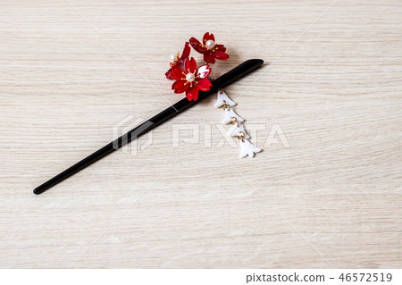 Japanese kanzashi hair accessory on a wooden table 46572519